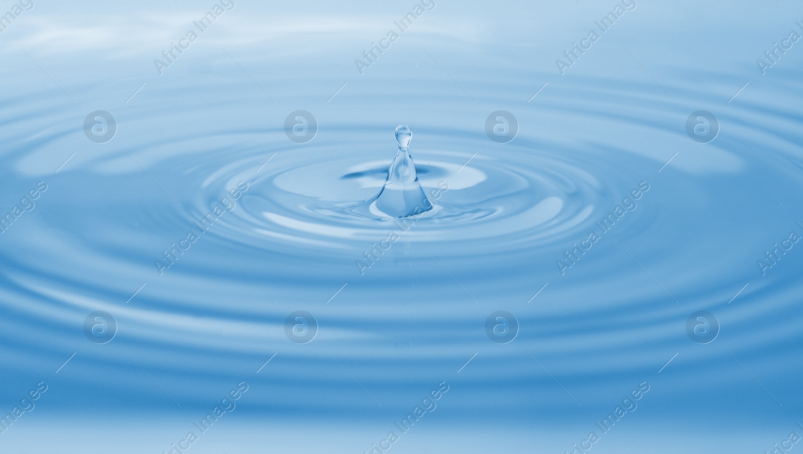 Photo of Splash of water with drops as background, closeup