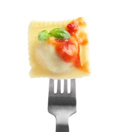 Photo of Fork with tasty ravioli isolated on white