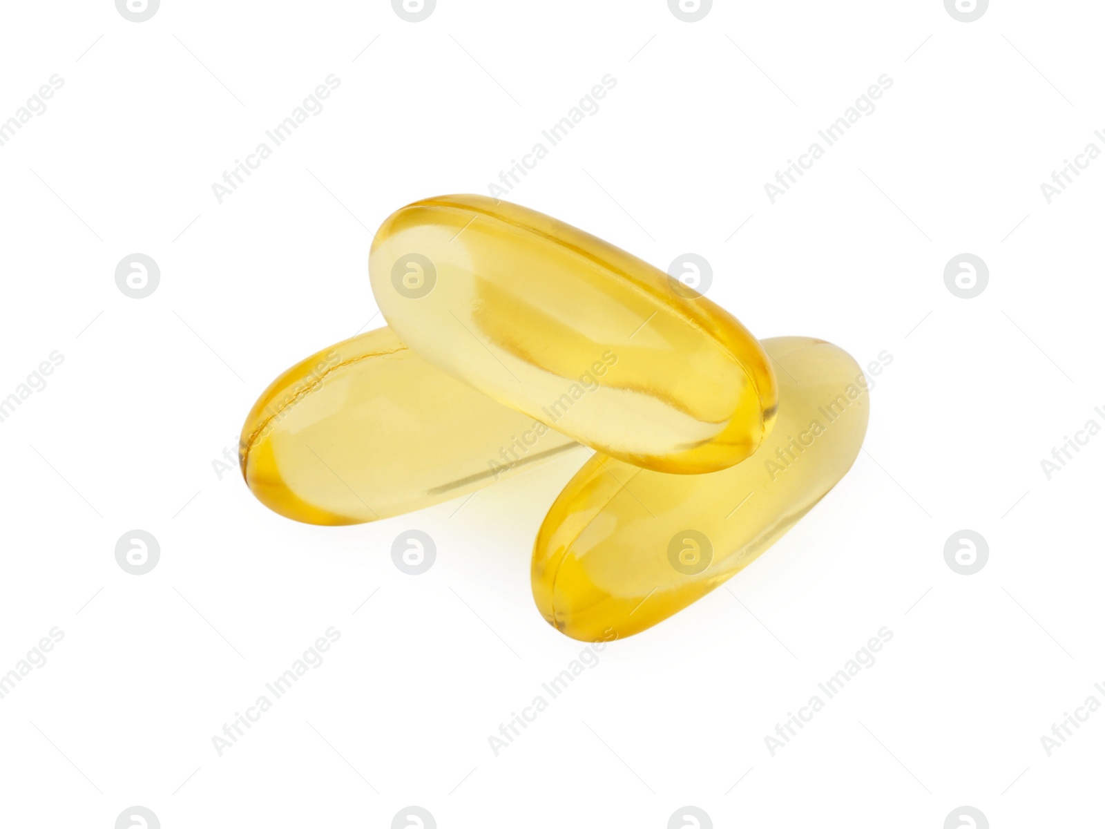 Photo of Many yellow vitamin capsules isolated on white