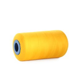 Photo of Spool of yellow sewing thread isolated on white