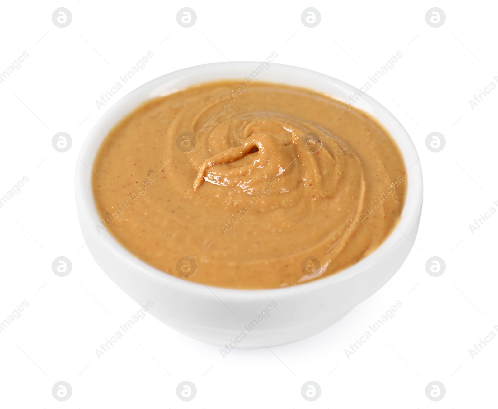 Photo of Delicious nut butter in bowl isolated on white