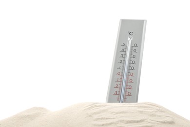 Weather thermometer in sand against white background