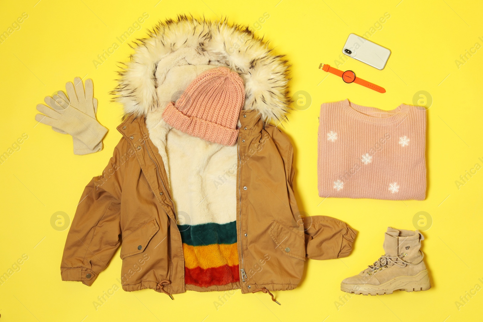 Photo of Flat lay composition with warm female clothes for winter vacation on color background