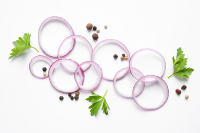 Flat lay composition with cut onion and spices on white background