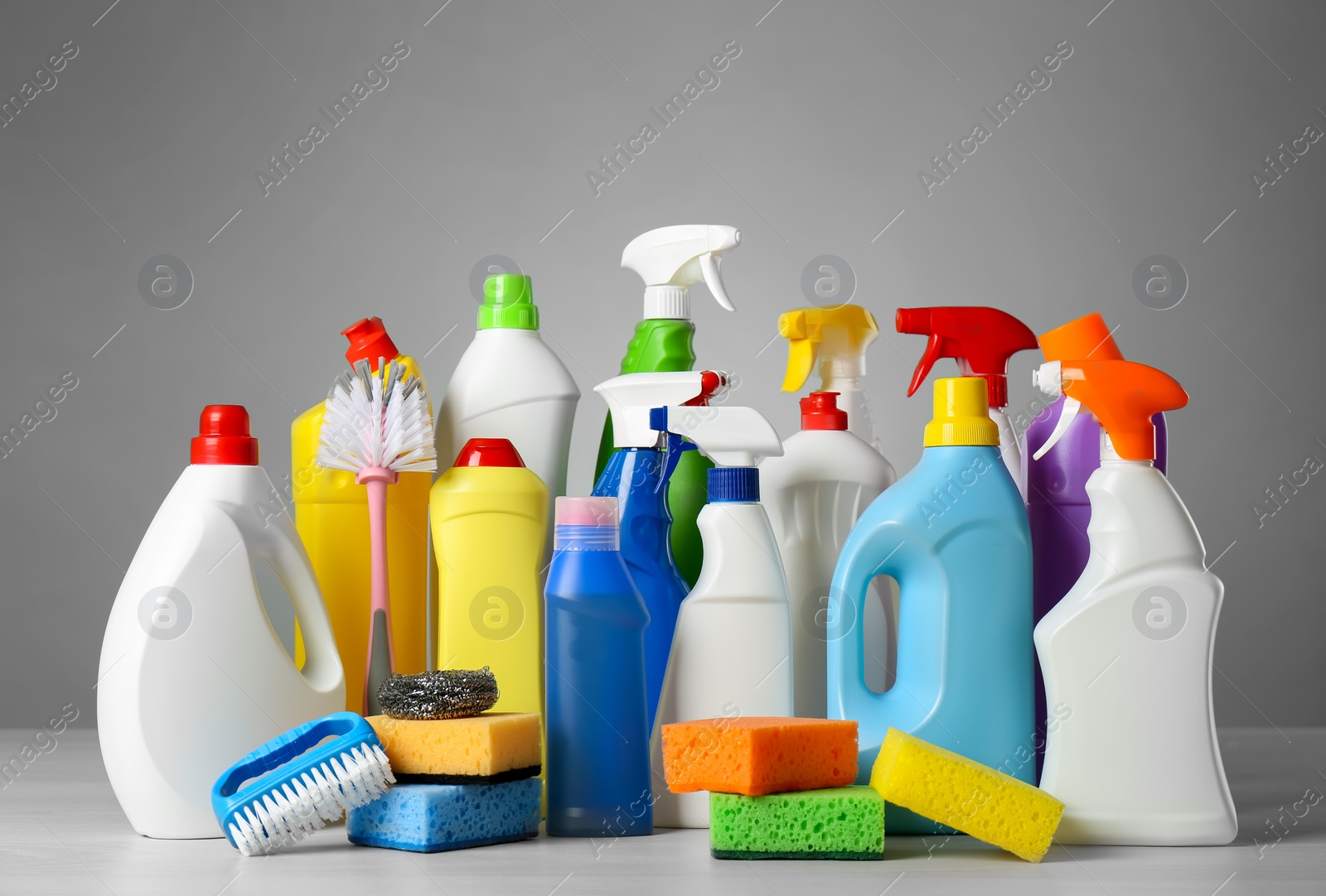 Photo of Different cleaning products and supplies on light table