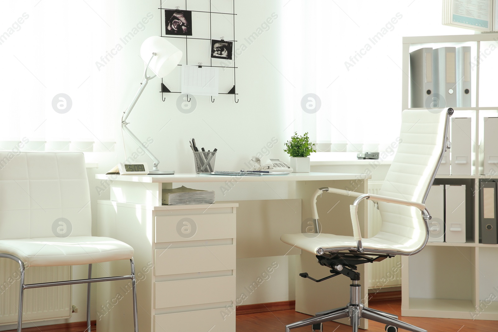 Photo of Interior of modern medical office. Doctor's workplace