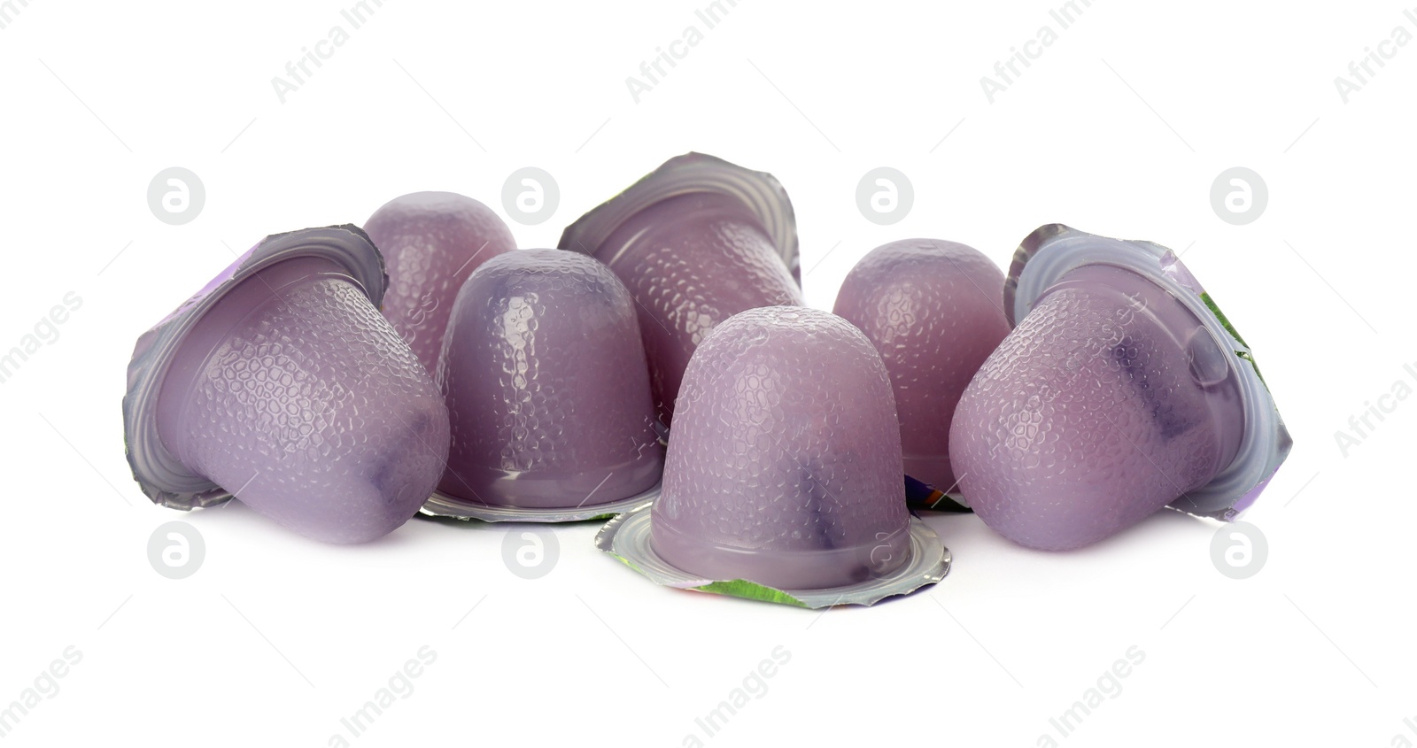 Photo of Tasty bright jelly cups on white background