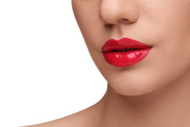 Woman with bright lip gloss on white background, closeup