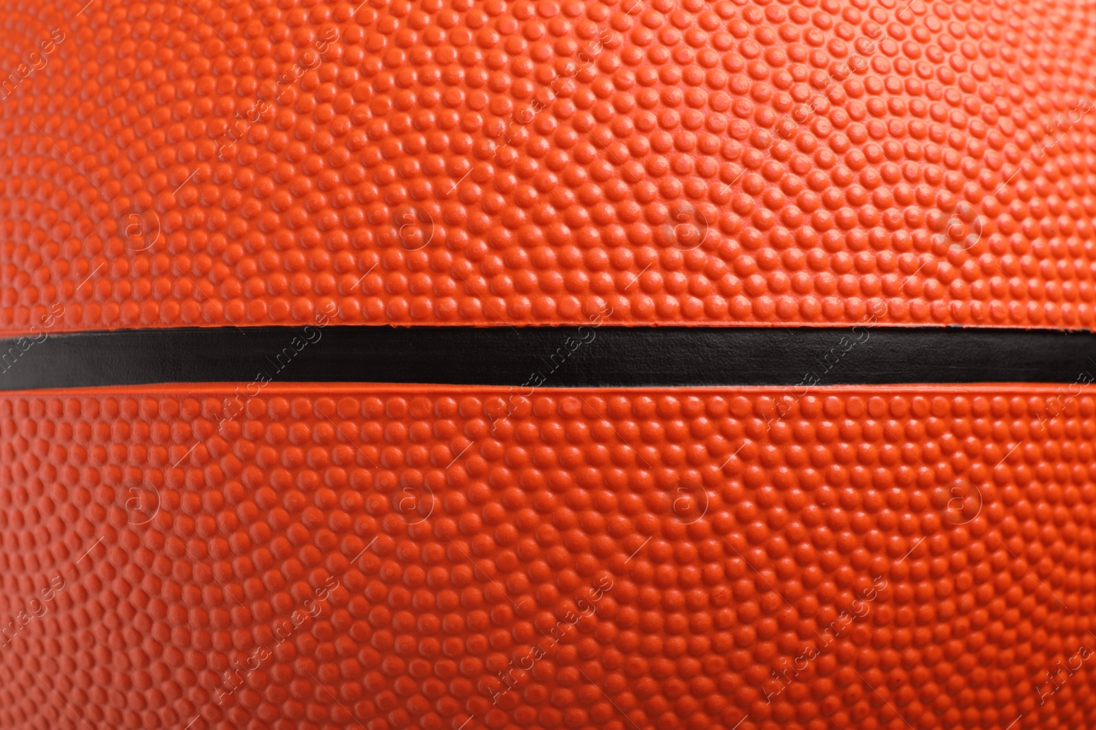 Photo of Orange basketball ball as background, closeup view