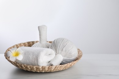 Photo of Spa composition with care products on white marble table