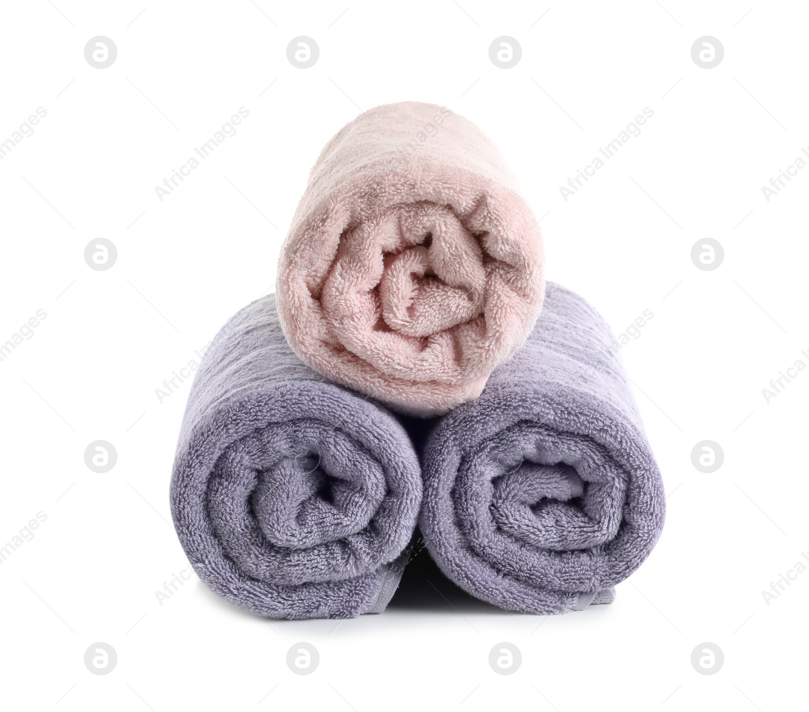 Photo of Fresh soft rolled towels isolated on white