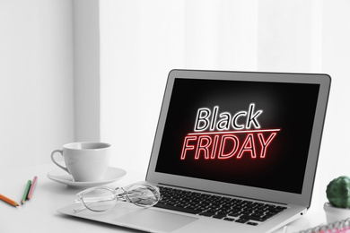 Image of Black Friday announcement on laptop screen. Online shopping