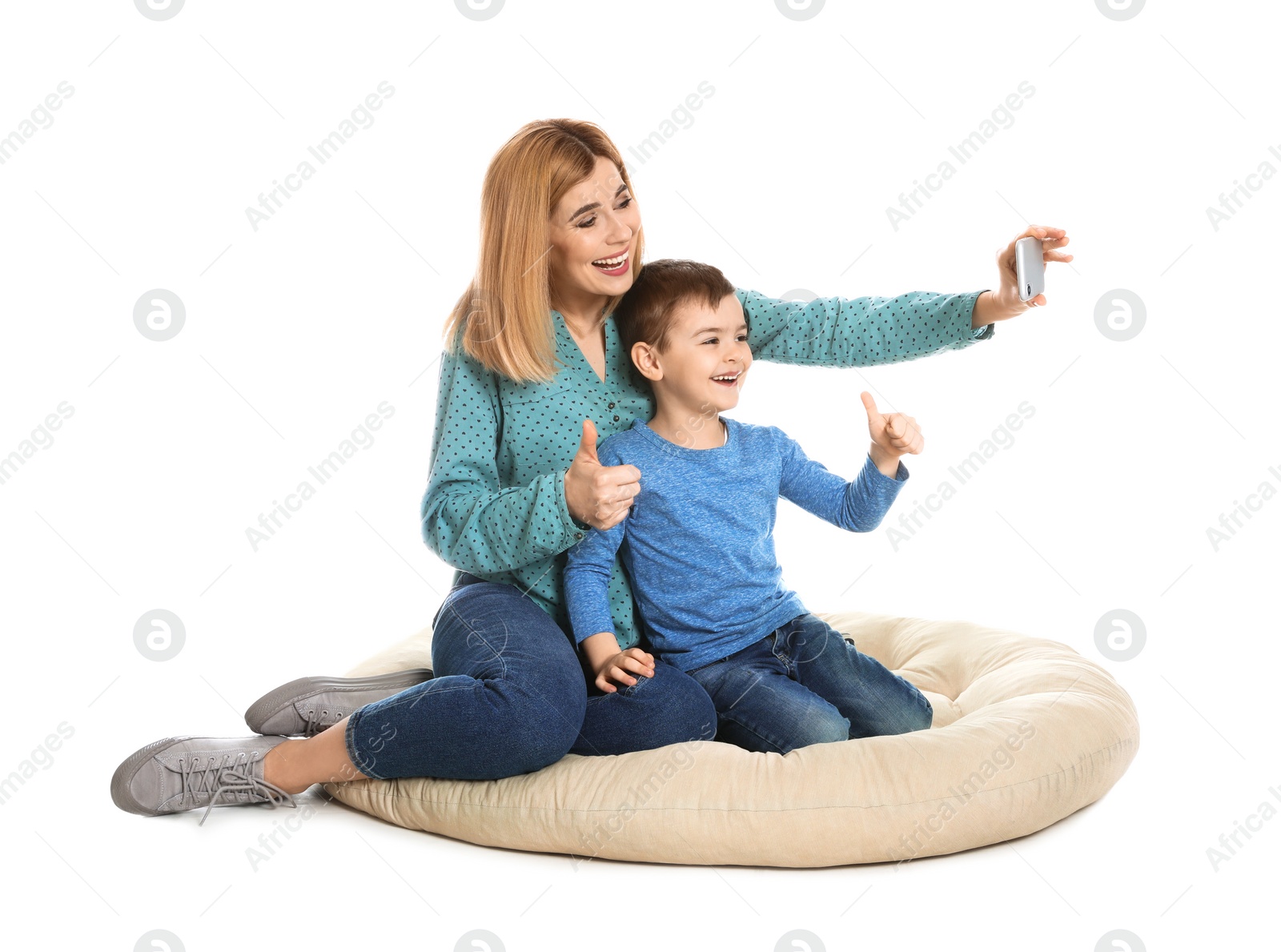 Photo of Mother and her son using video chat on smartphone, white background