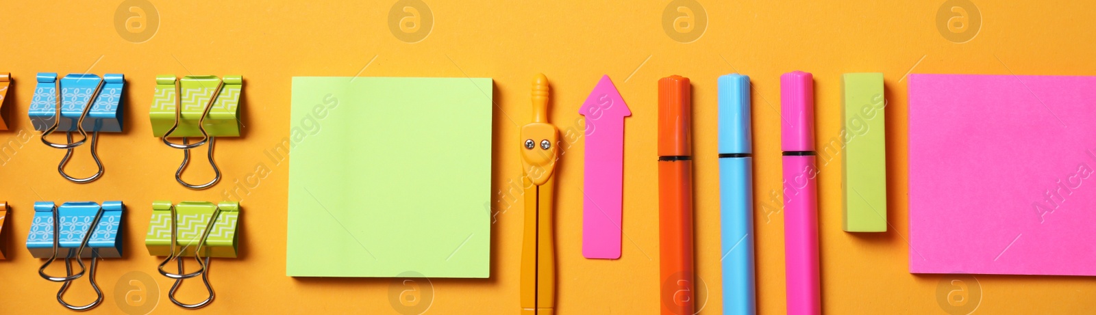 Image of Different school stationery on orange background, flat lay. Banner design