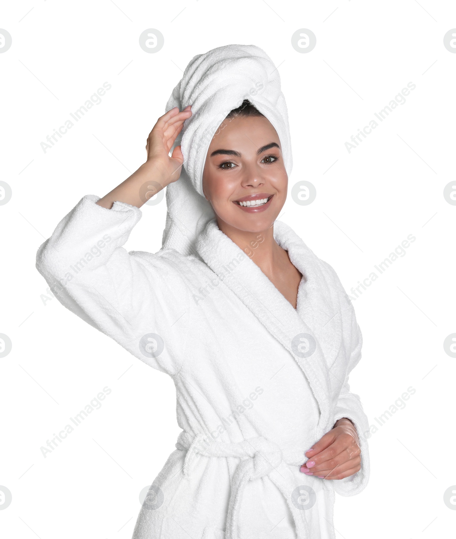 Photo of Beautiful young woman wearing bathrobe and towel on head against white background