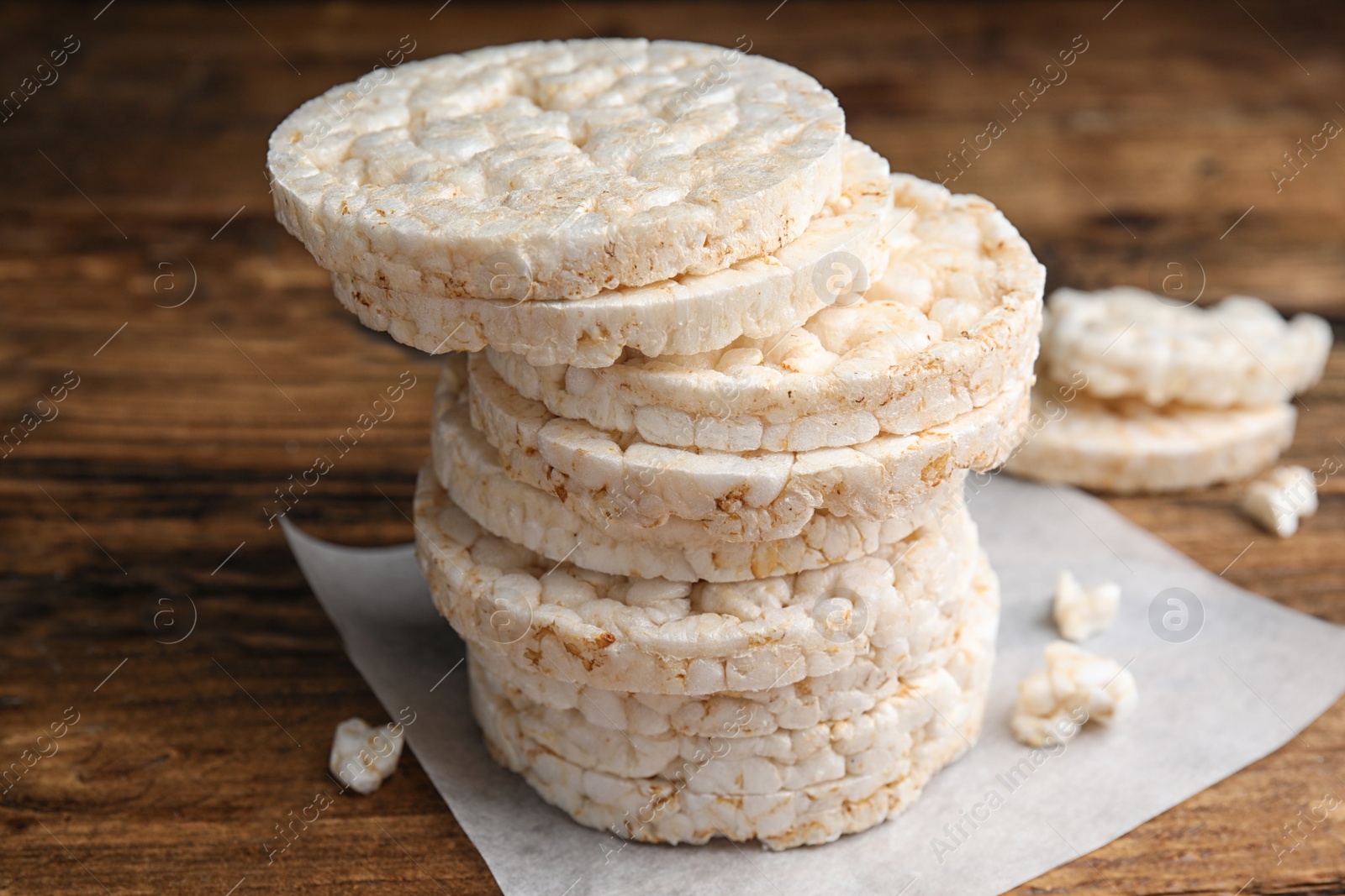 Photo of Stack of puffed rice cakes on wooden table