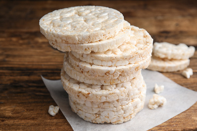 Photo of Stack of puffed rice cakes on wooden table