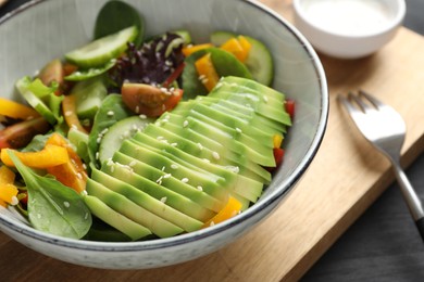 Healthy dish high in vegetable fats on wooden table, closeup