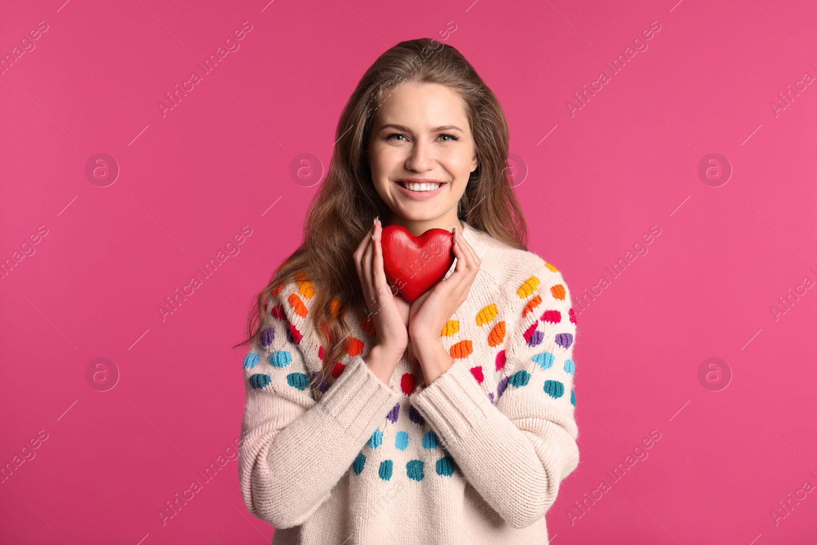 Photo of Portrait of young woman with decorative heart on color background