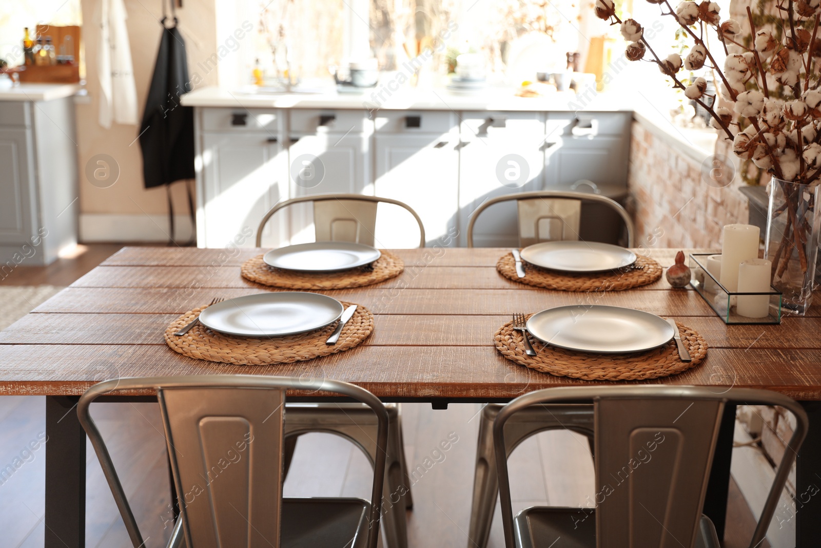 Photo of Stylish kitchen interior with dining table and chairs