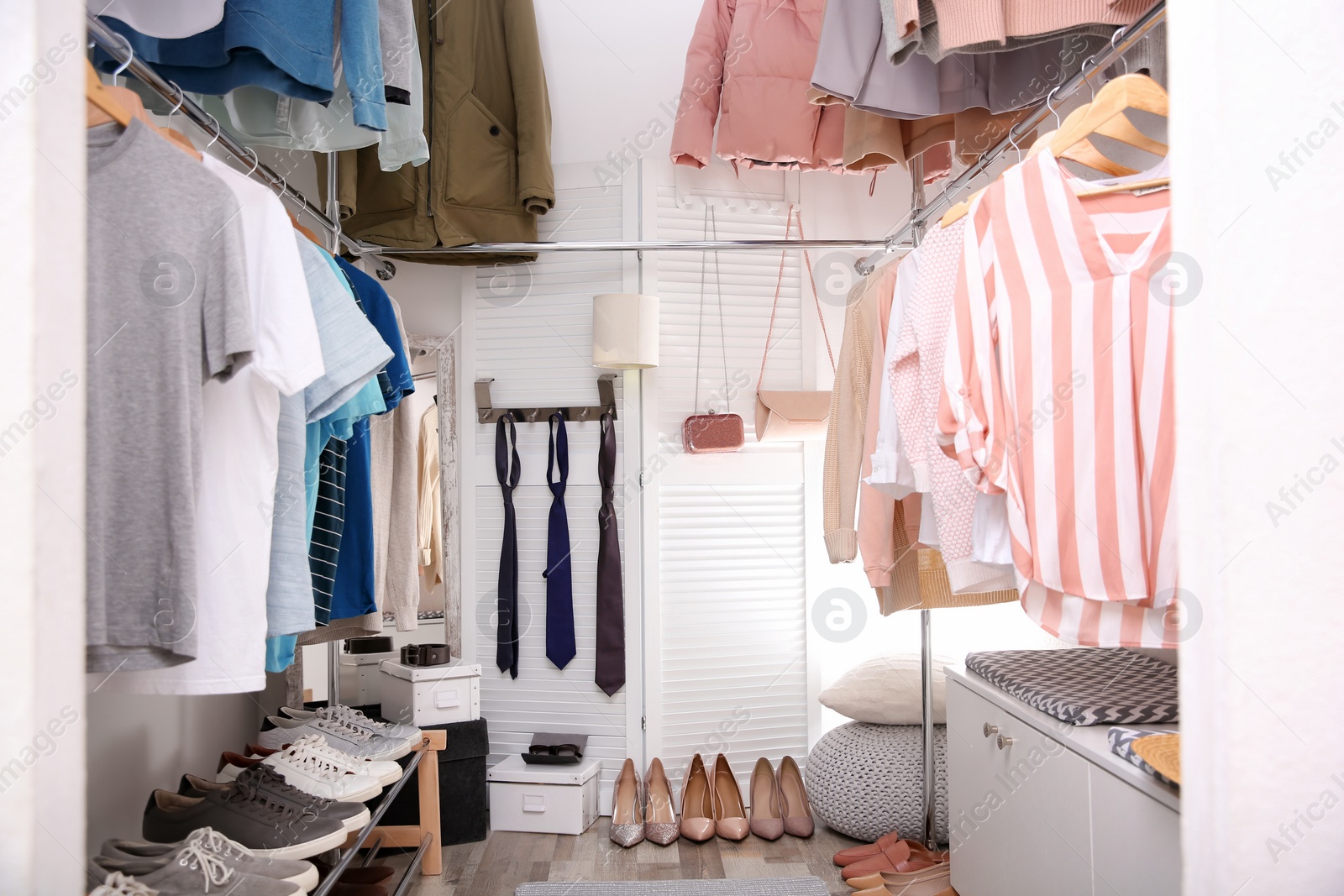 Photo of Modern dressing room with different stylish clothes and accessories