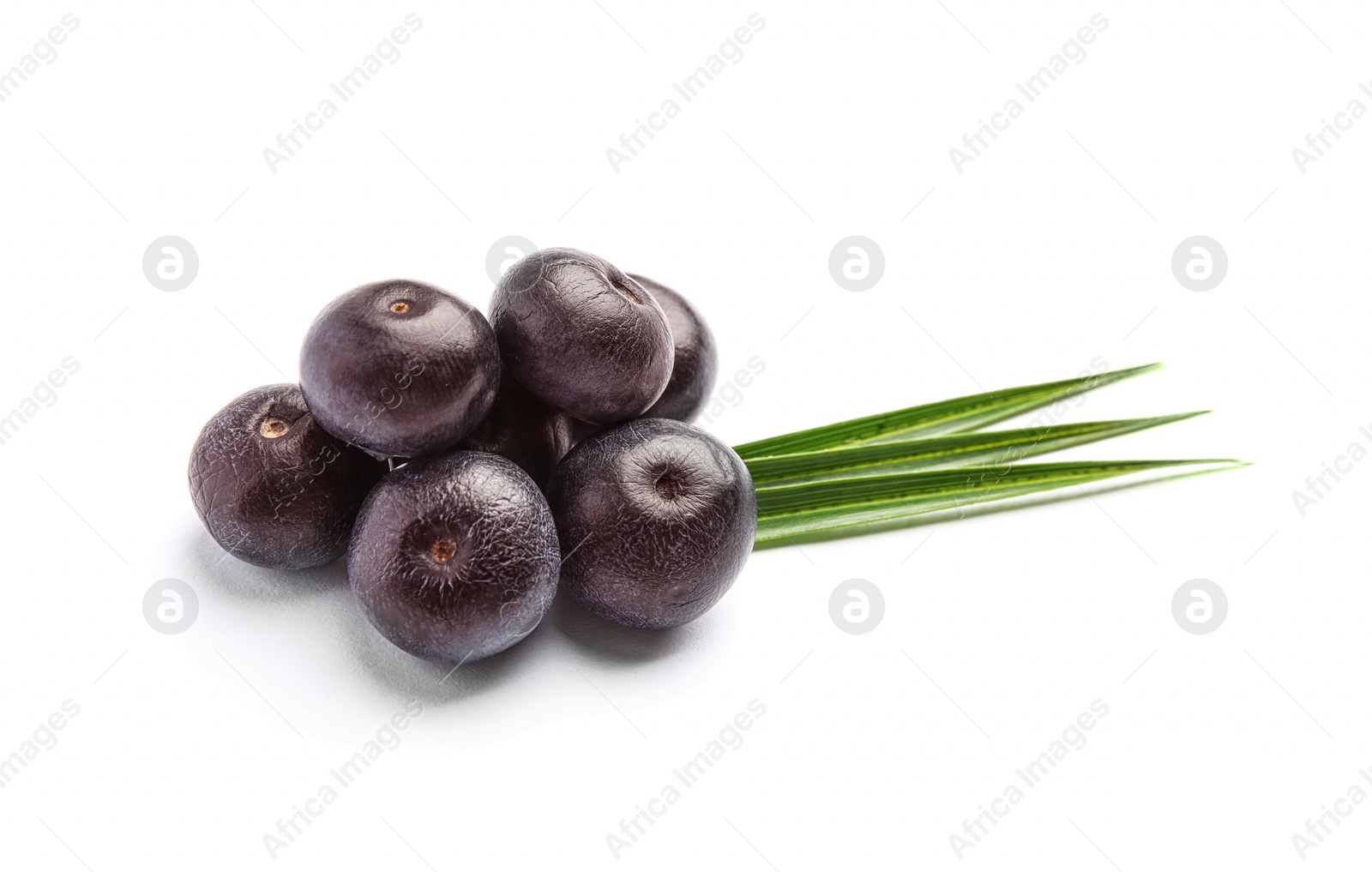 Photo of Fresh acai berries with leaves on white background