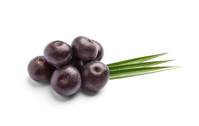 Fresh acai berries with leaves on white background