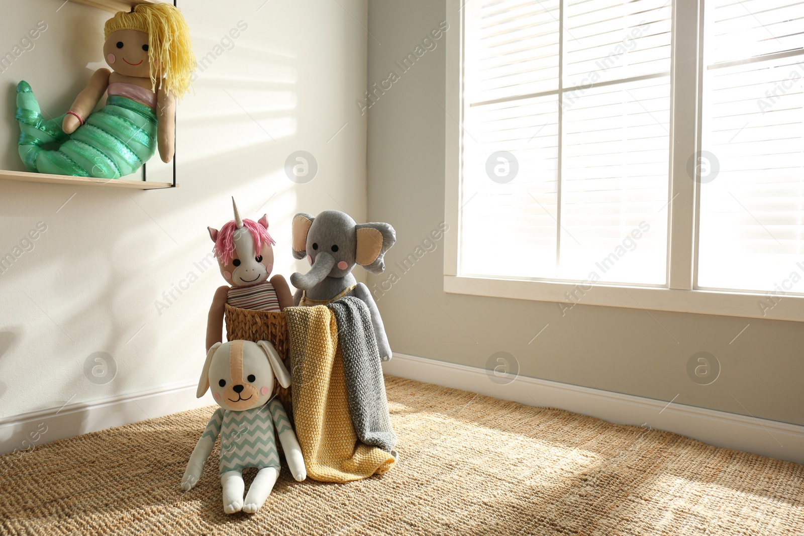 Photo of Many cute toys indoors. Baby room interior elements