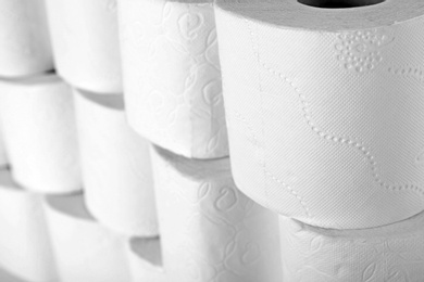 Photo of Many rolls of toilet paper as background. Personal hygiene