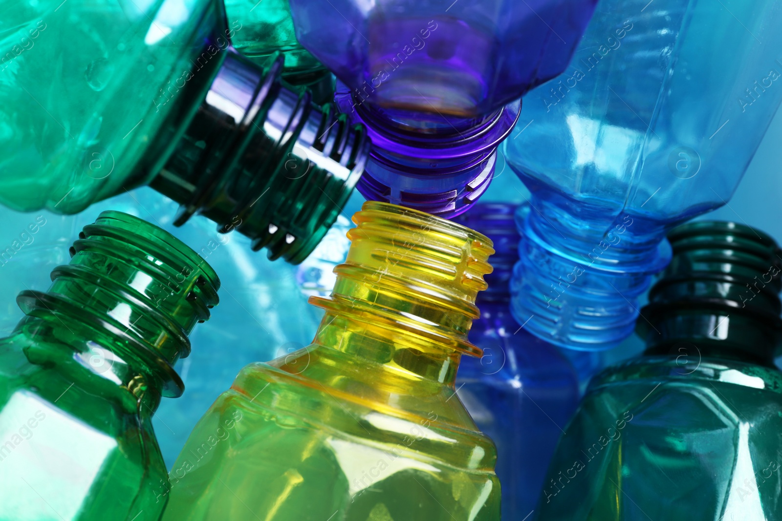 Photo of Used plastic bottles as background, closeup. Recycling problem