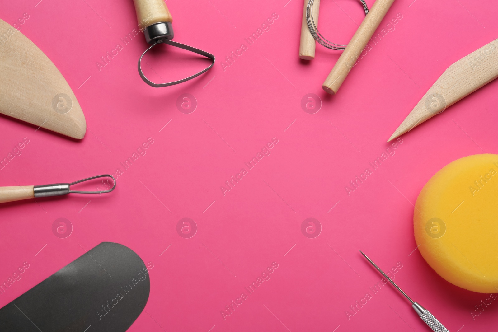 Photo of Set of clay modeling tools on pink background, flat lay. Space for text