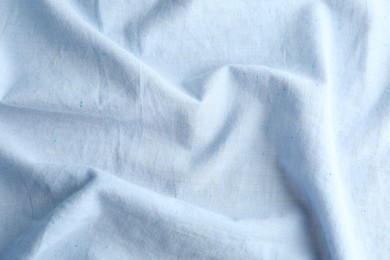 Texture of light blue fabric as background, closeup