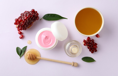 Photo of Composition with natural homemade mask, pomegranate and ingredients on white background, top view