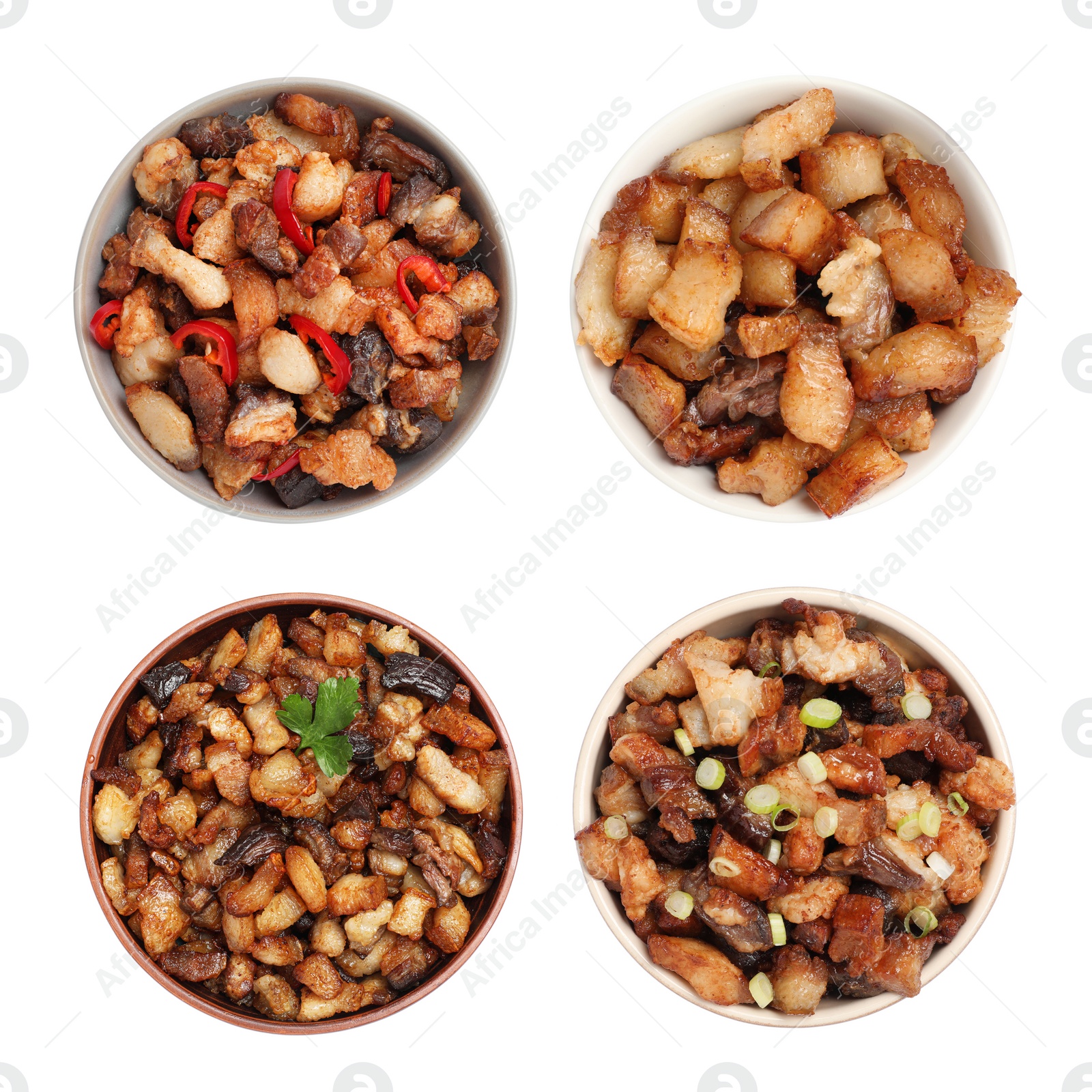 Image of Set with tasty fried cracklings on white background, top view. Cooked pork lard