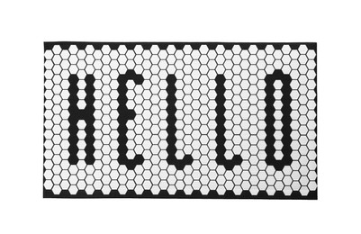 Photo of New clean door mat with word Hello isolated on white, top view