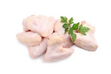 Photo of Raw chicken wings with parsley on white background, top view