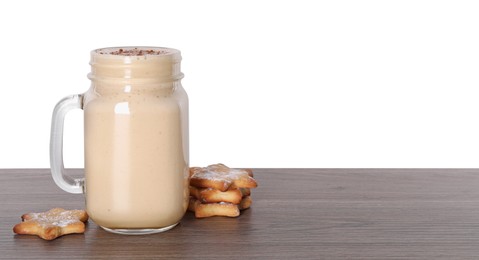 Photo of Delicious eggnog and cookies on wooden table against white background. Space for text