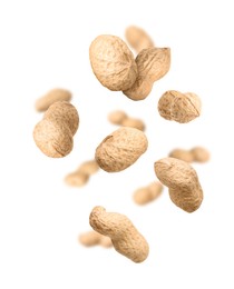 Image of Unpeeled peanuts in air on white background