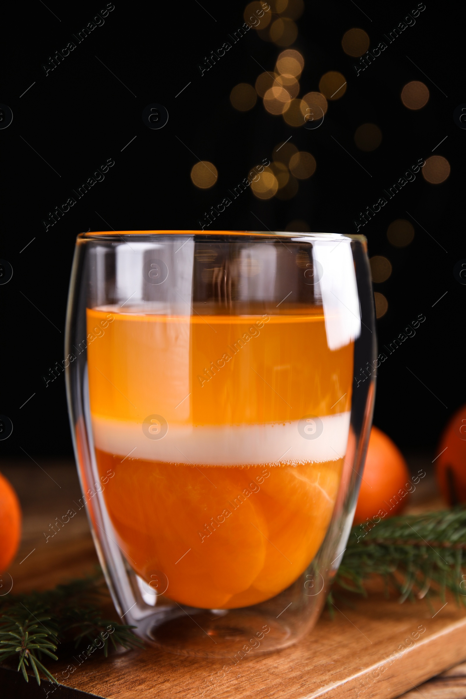 Photo of Delicious tangerine jelly on wooden board, closeup