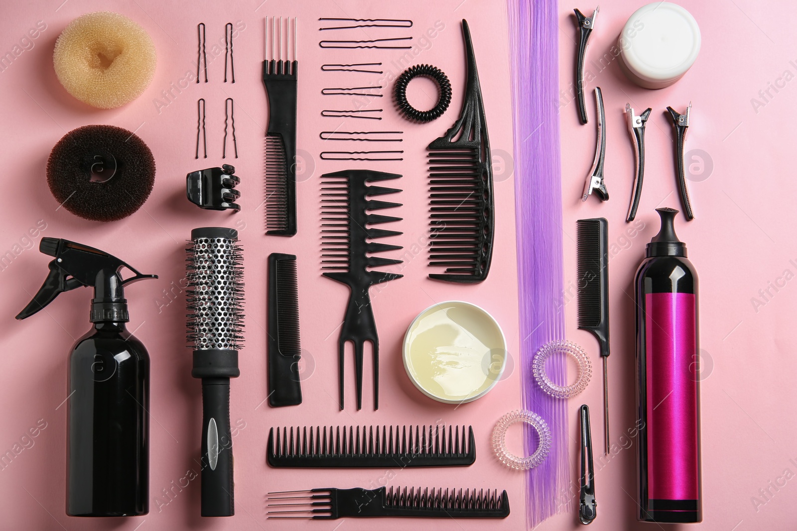 Photo of Flat lay composition with hair salon equipment on color background