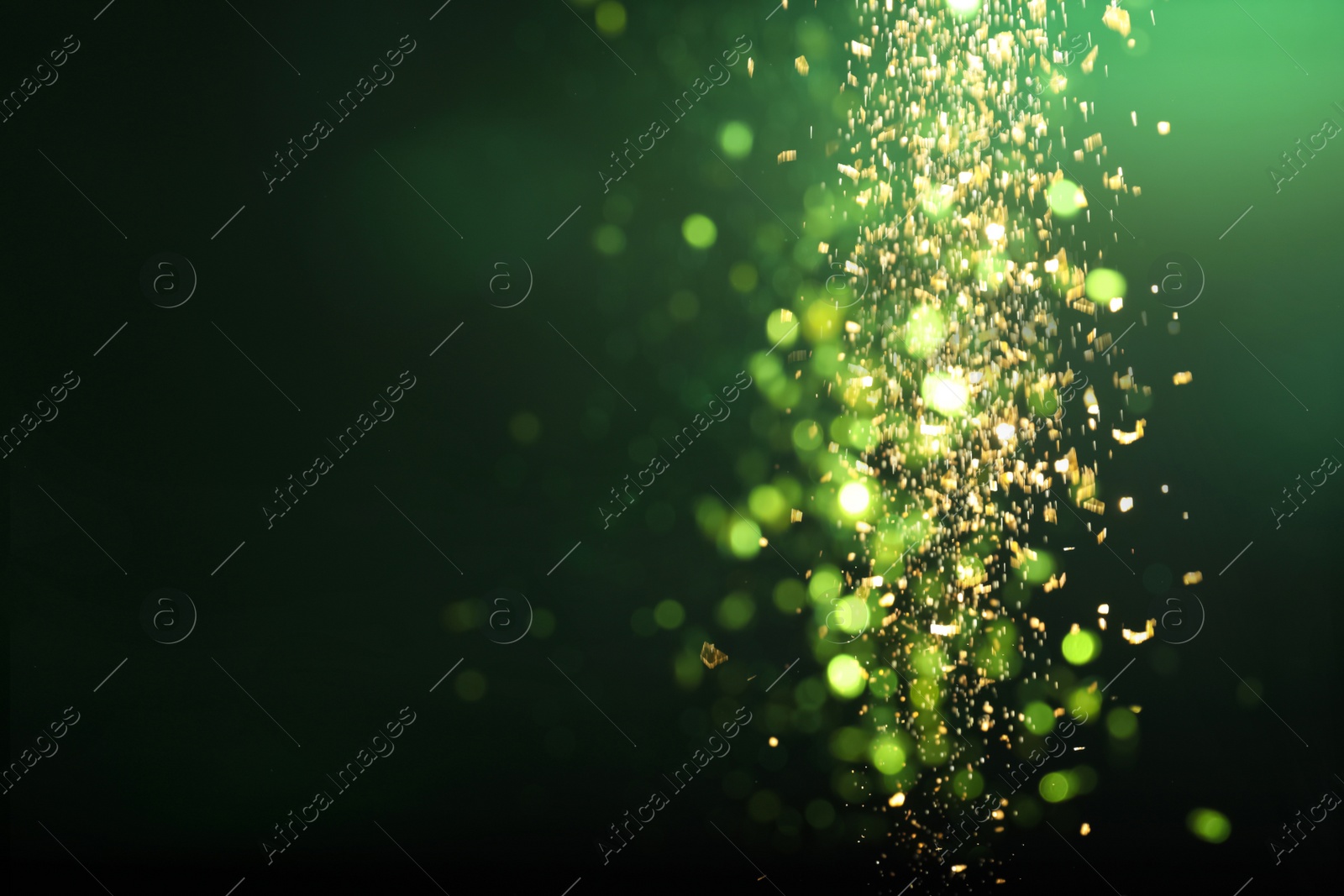 Photo of Blurred view of festive lights on green background. Bokeh effect