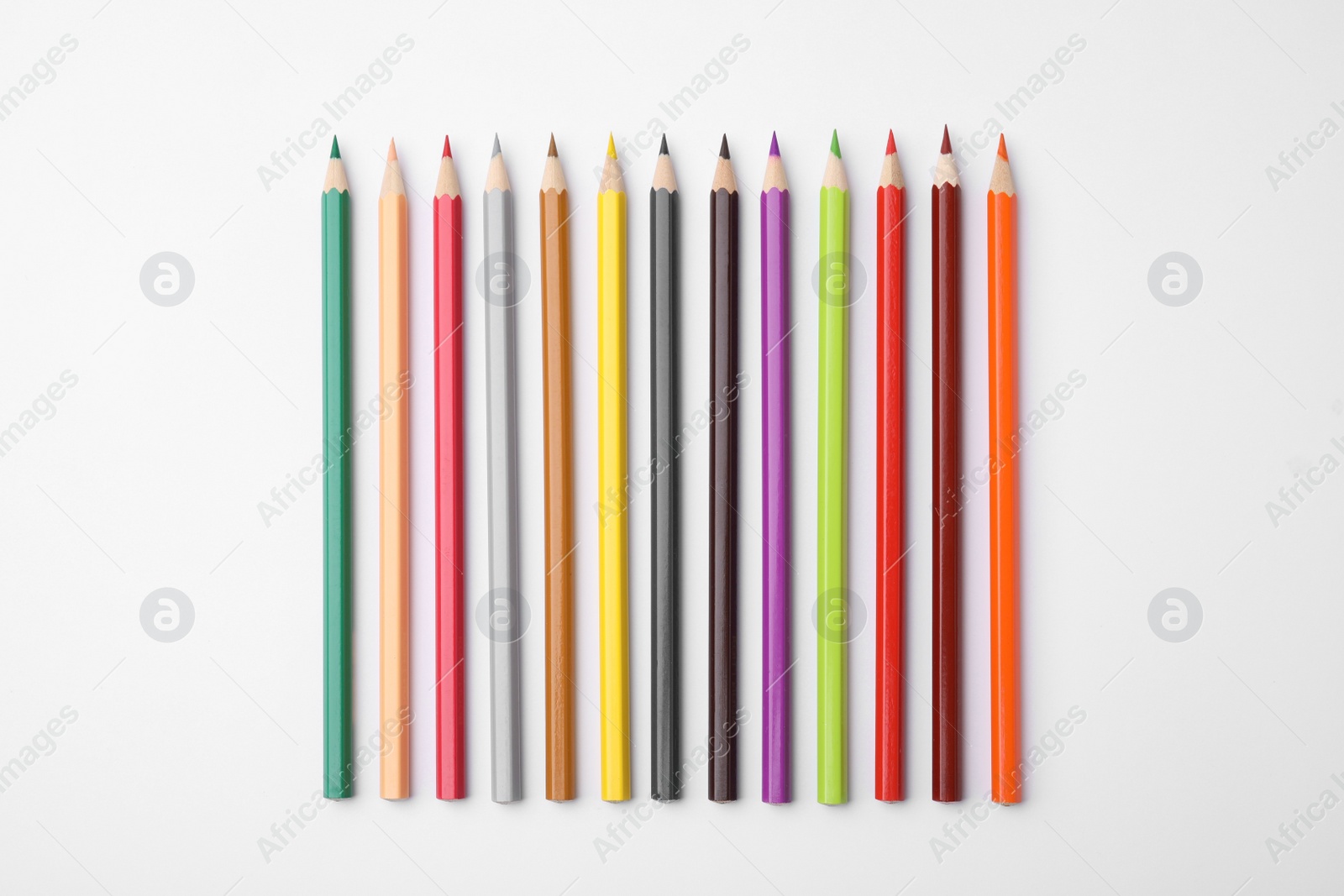 Photo of Colorful wooden pencils on white background, flat lay