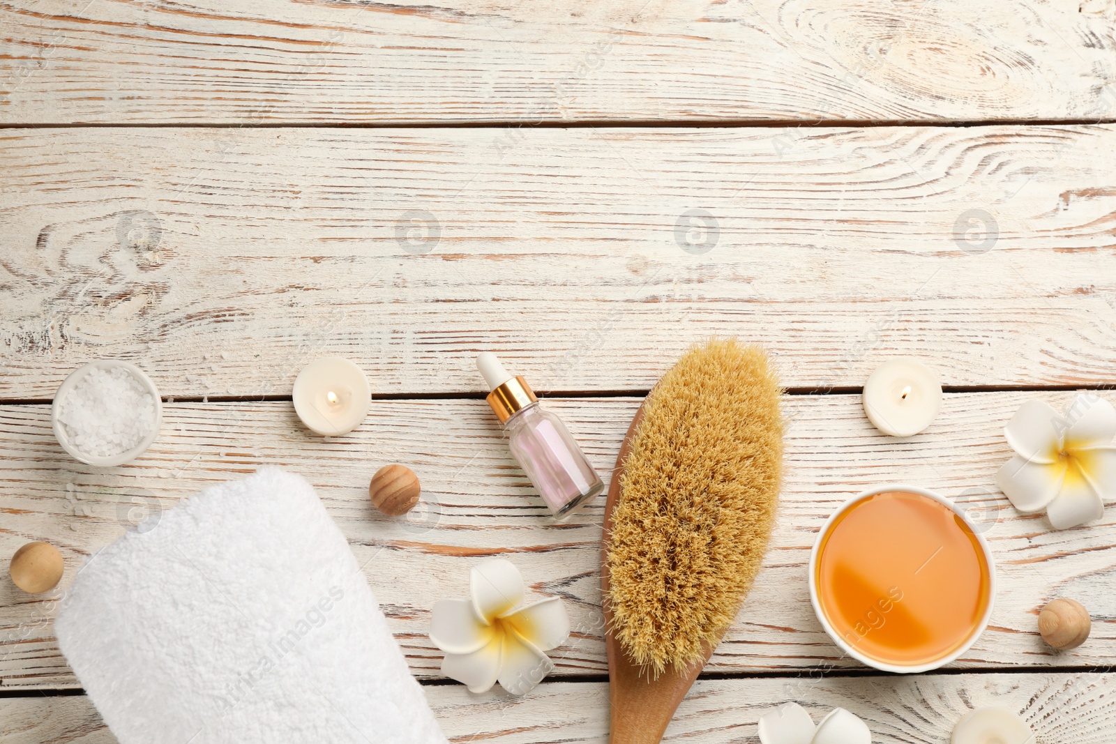 Photo of Flat lay composition with cosmetic products on white wooden background, space for text. Spa body wraps