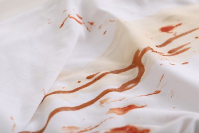 Photo of White shirt with stain of sauce, closeup