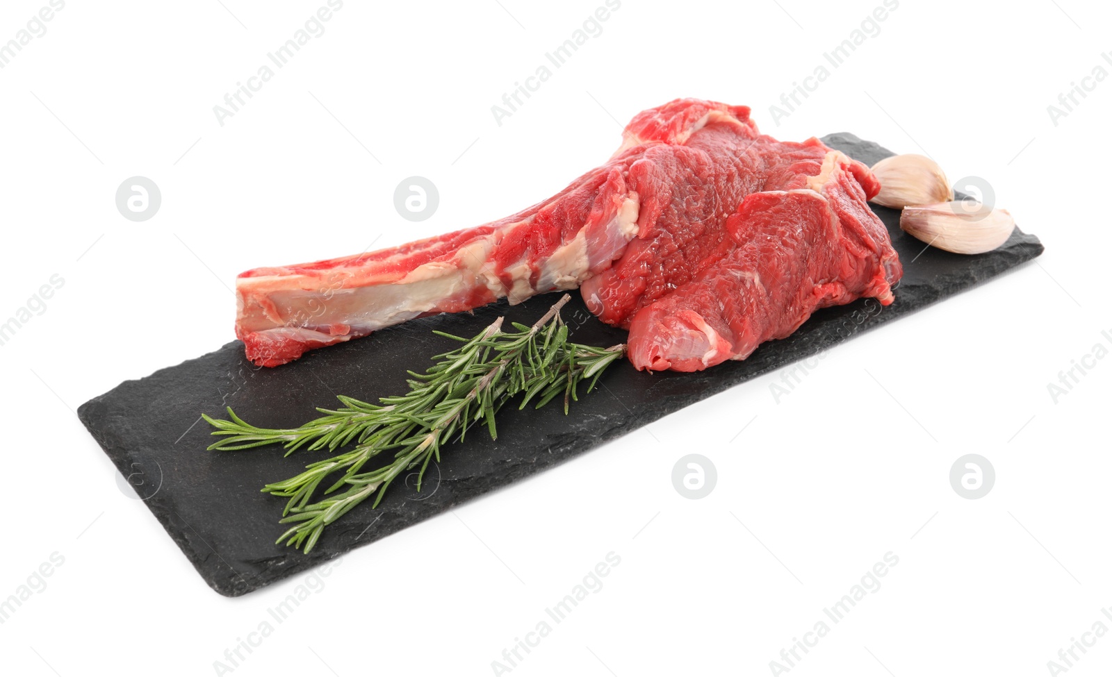 Photo of Raw ribeye steak and spices isolated on white