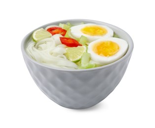 Photo of Bowl of delicious rice noodle soup with celery and egg isolated on white