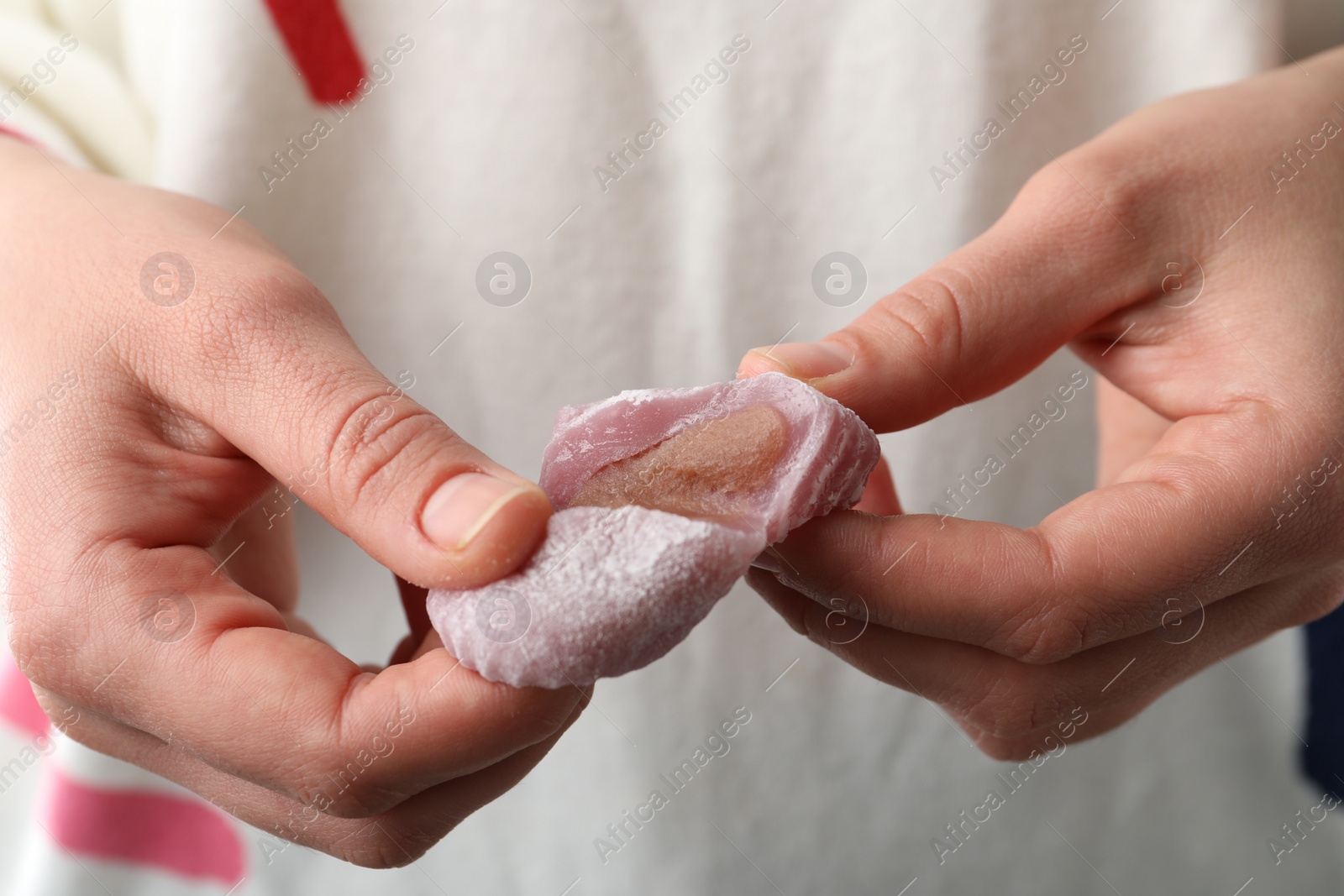 Photo of Woman with delicious mochi, closeup. Japanese cuisine