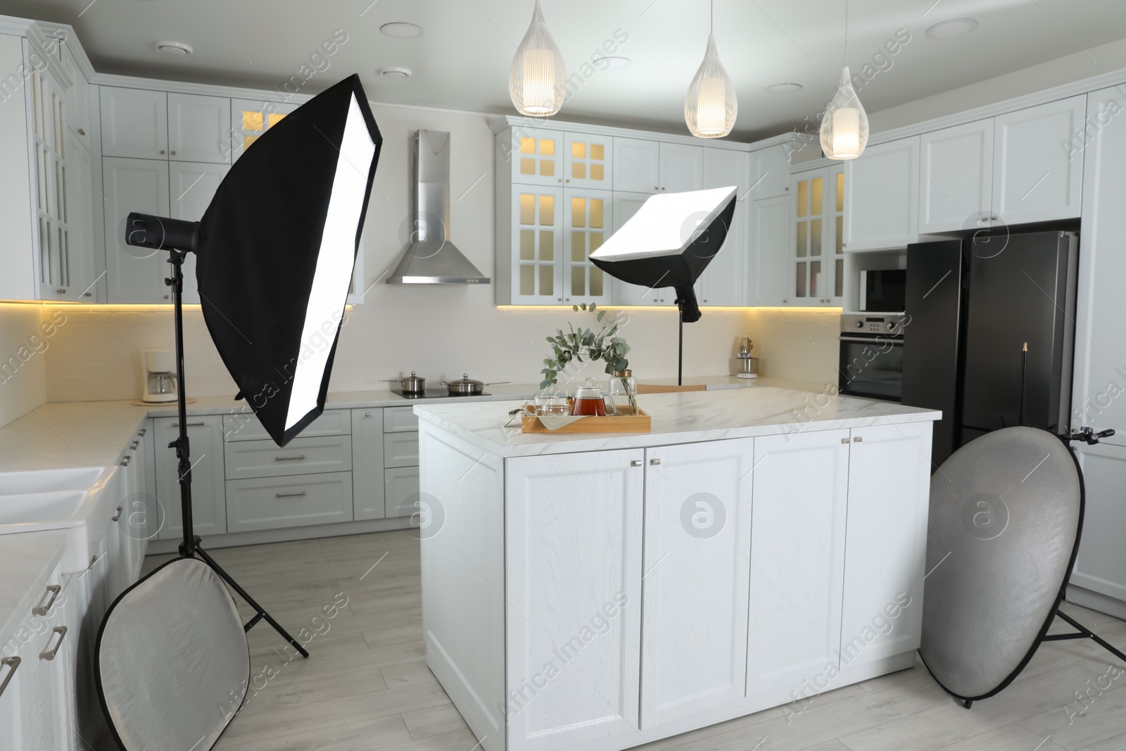 Photo of Professional photo studio equipment prepared for shooting kitchen interior