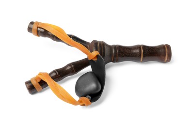 Photo of Black wooden slingshot with stone on white background