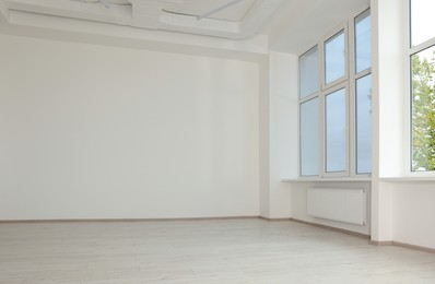 Photo of New empty room with clean windows and white walls